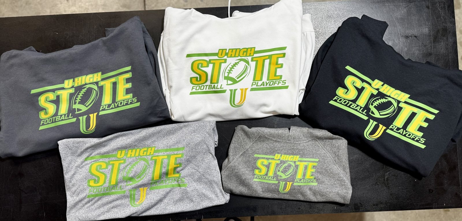 Custom U-High state football playoff shirts in several colors