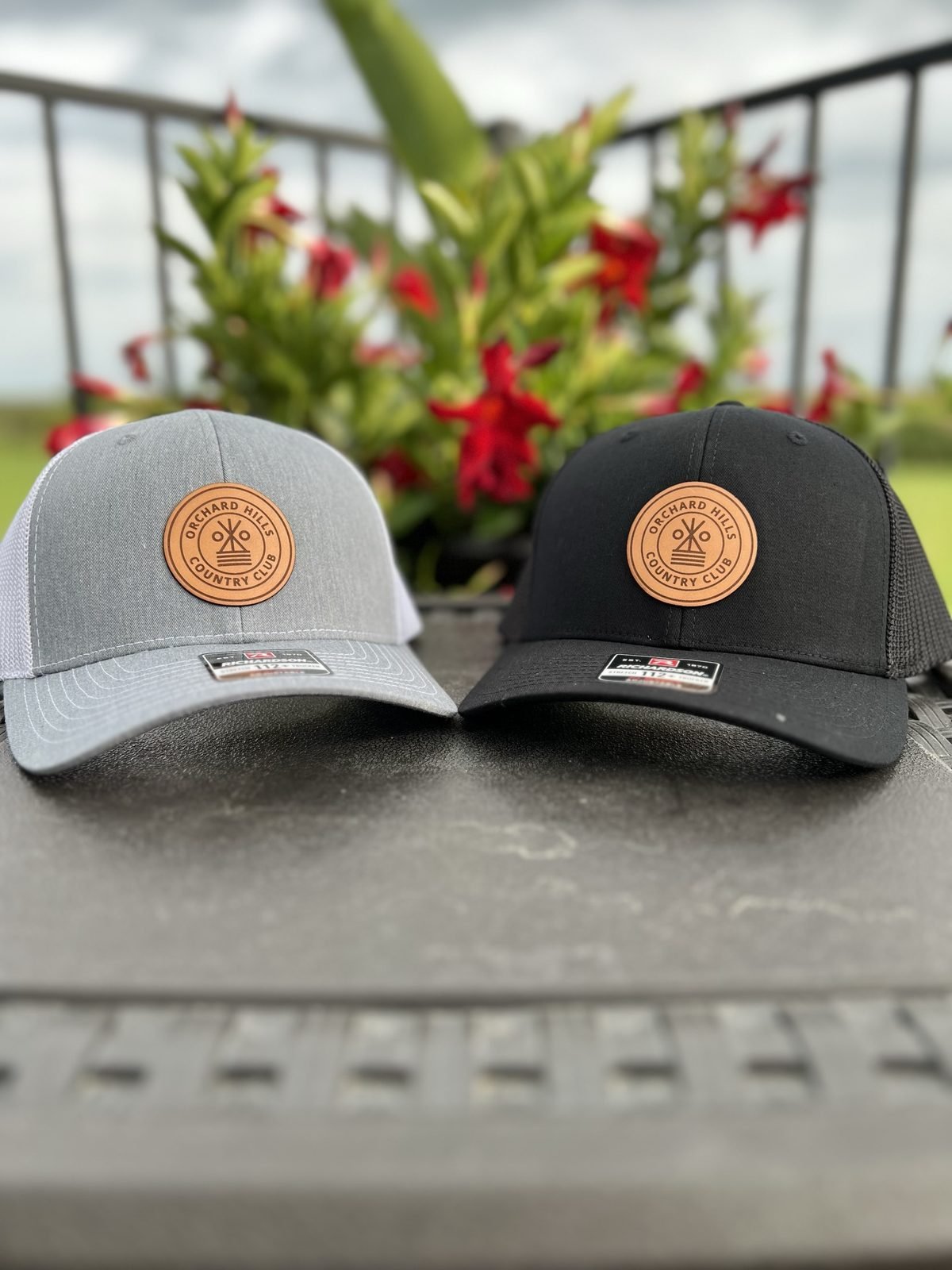 Gray and black custom country club hats with round leather patches