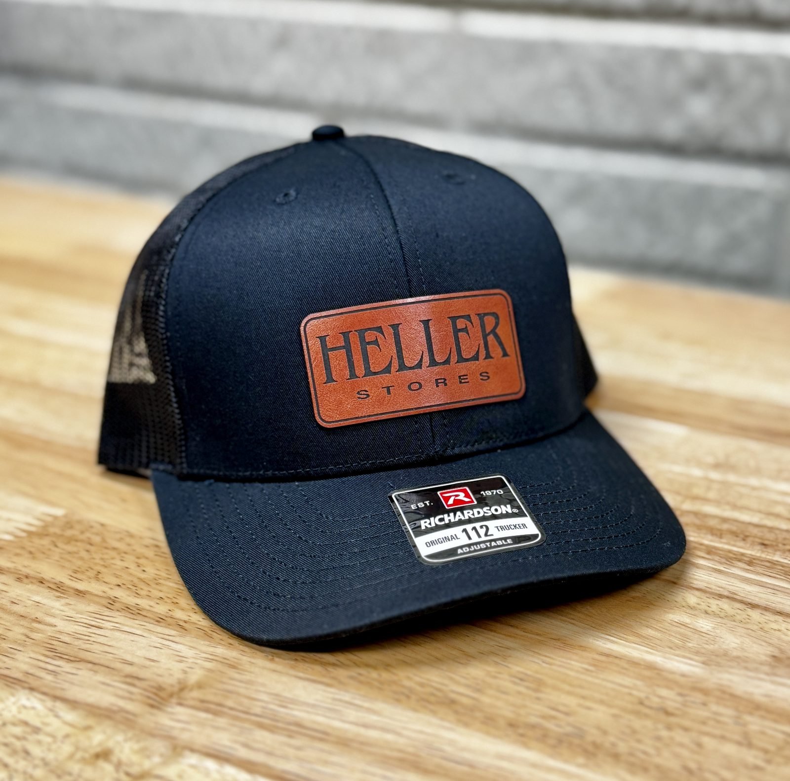 Navy Richardson trucker hat with Heller Stores leather patch