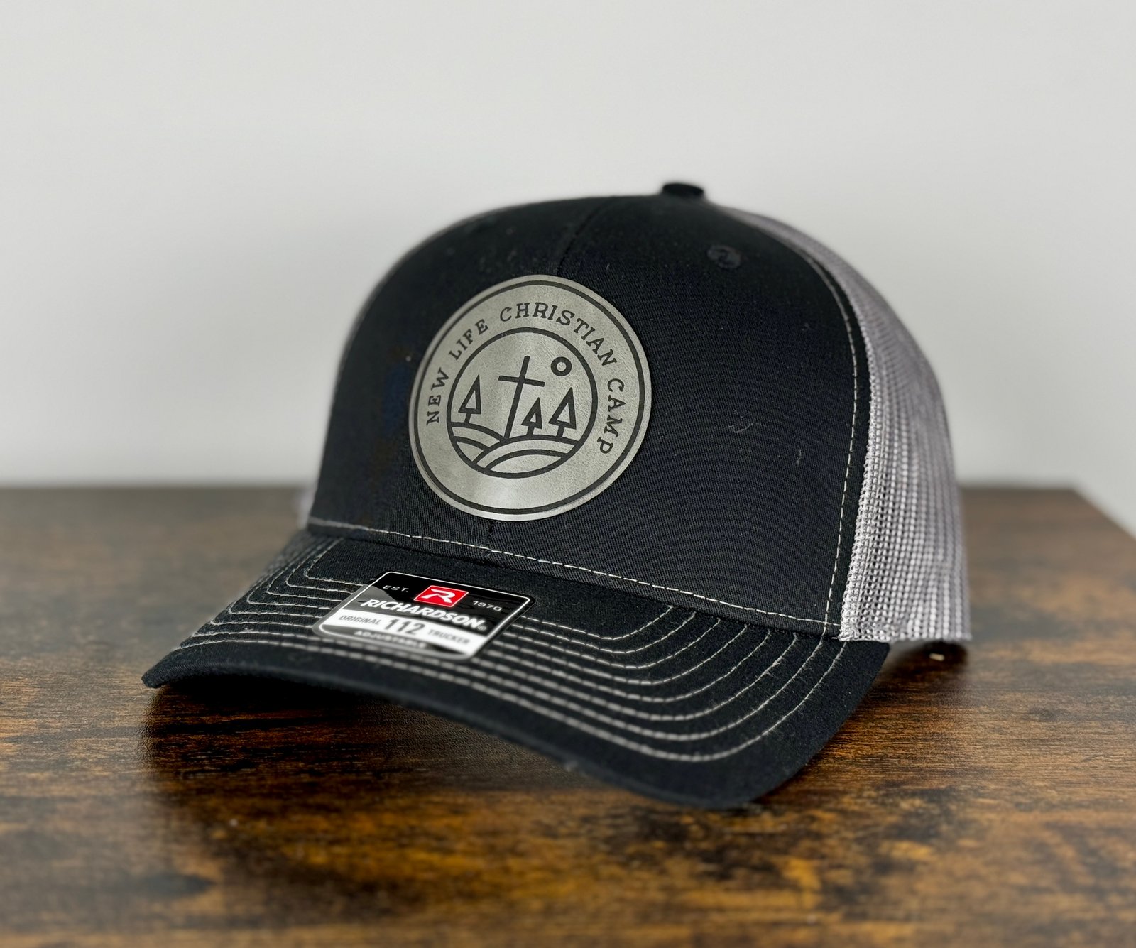Black cap with custom camp leather patch