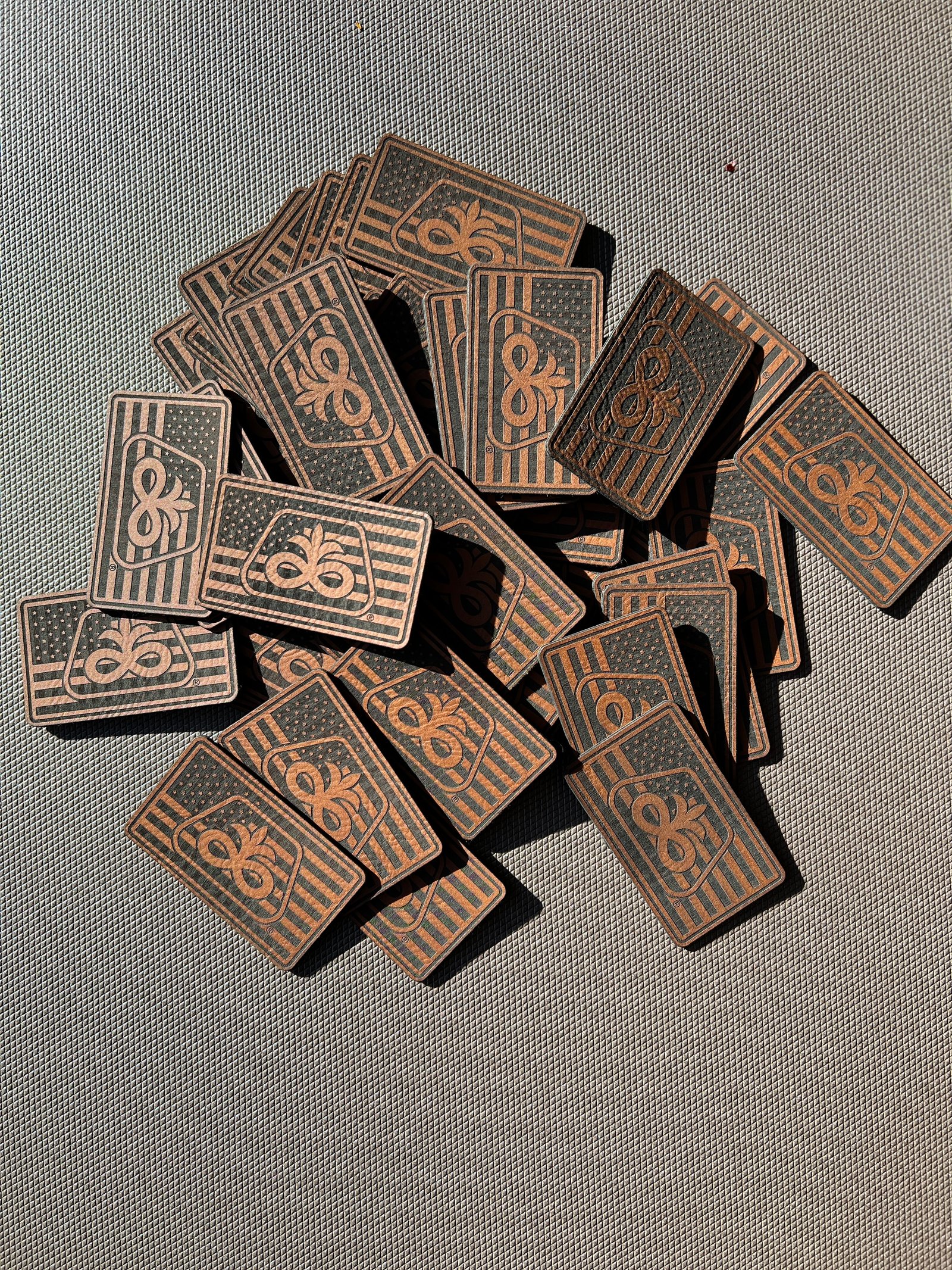Collection of engraved leather logo patches